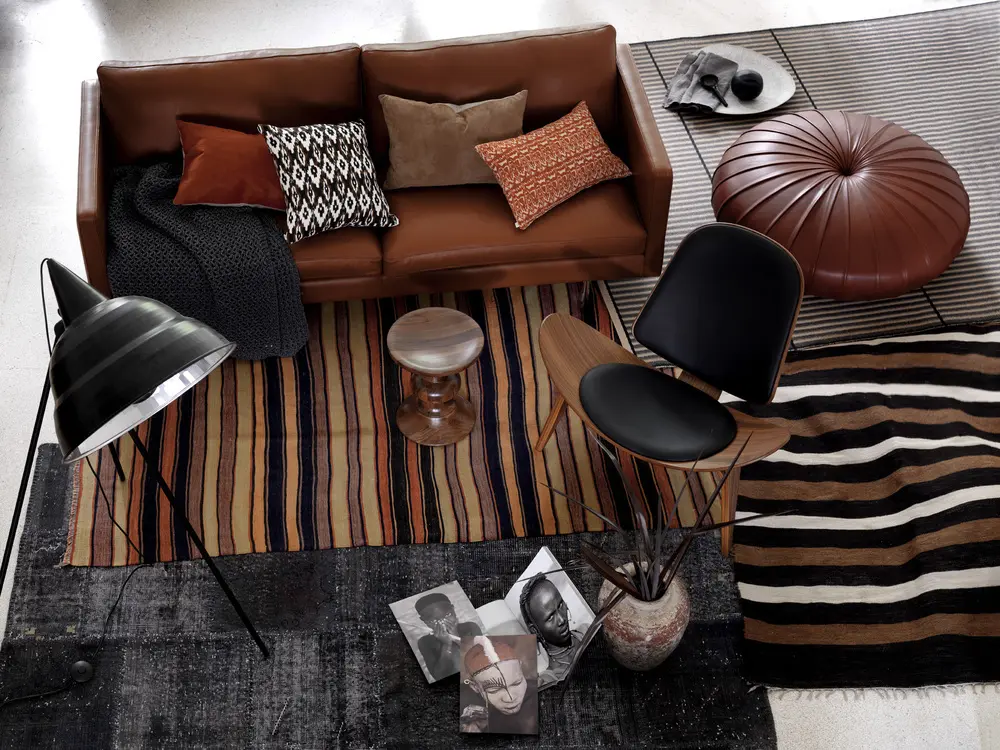 Modern African Boho living room featuring a neutral sofa and tribal rug